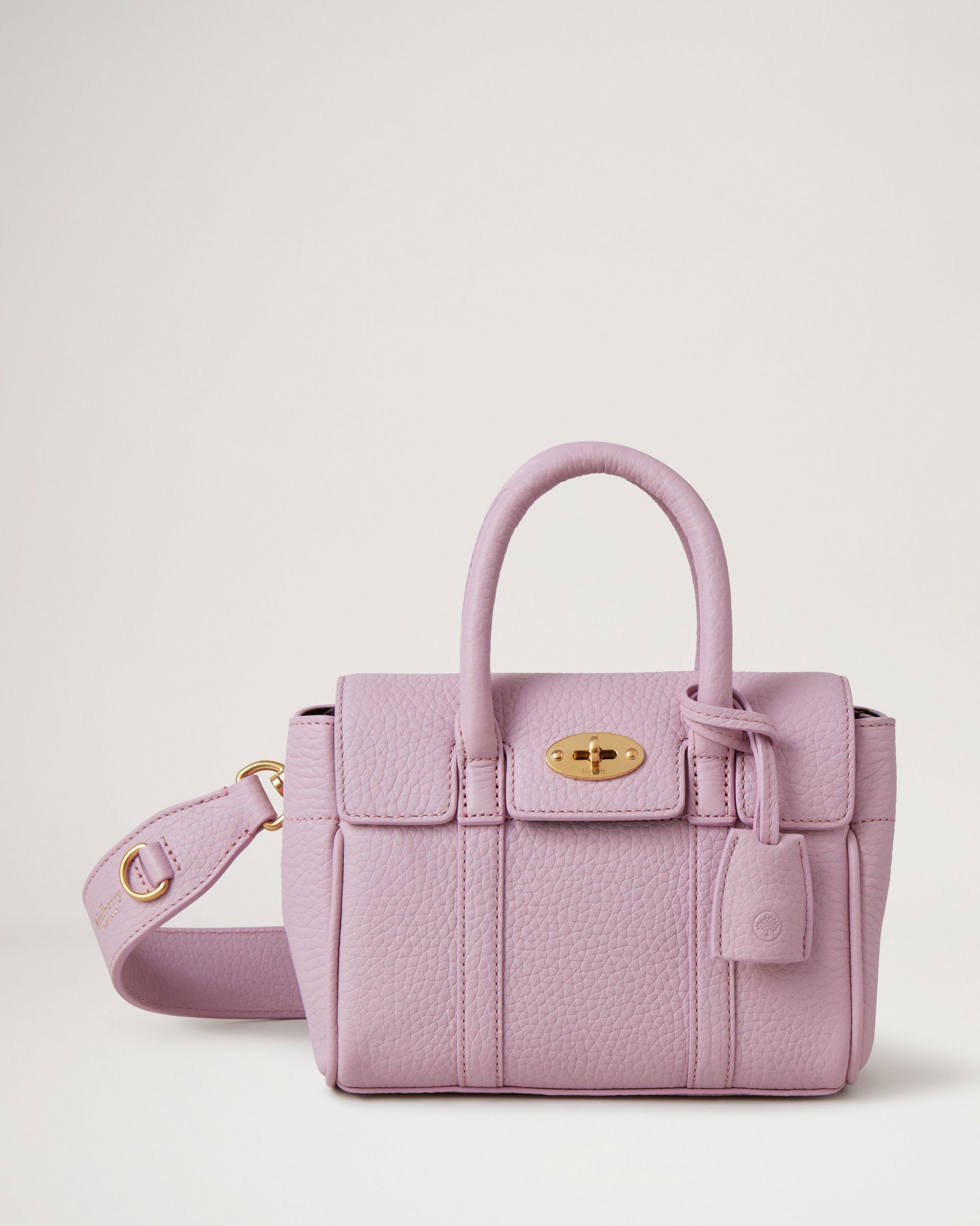 Lilac luxury handbag with brass finish