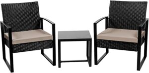 Garden furniture set with 2 black rattan chairs and a table.