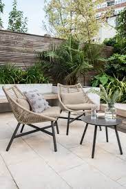 Lightweight portable garden furniture set of two beige basket chairs which come with a mini black table.