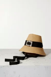 Straw hat with crystal embellished buckle and black ribbon