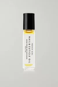 Nail and cuticle oil in black and white glass bottle