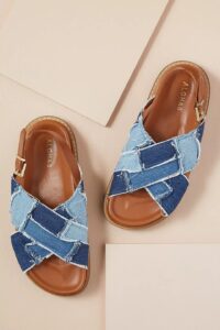 Brown sole sandals with cross cross denim straps and an open toe