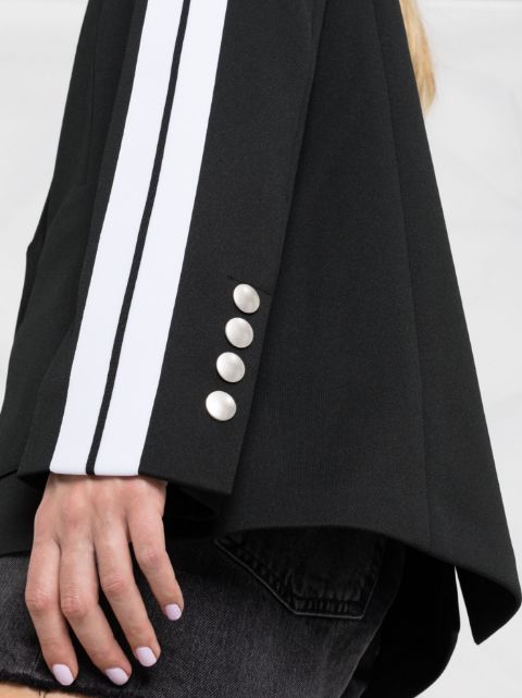 Women’s black blazer with white stripes.