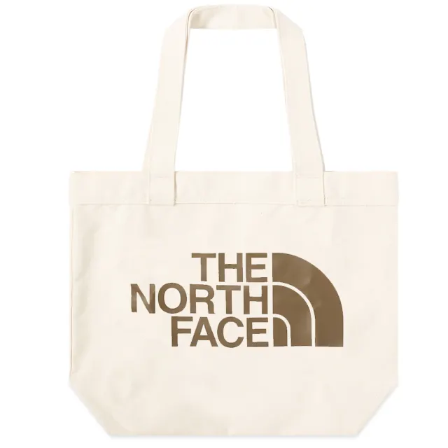 Plain beige ottoman tote bag with brown The North Face logo on it.