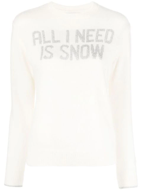 Women’s white knit jumper with the words “ALL I NEED IS SNOW” on it. 