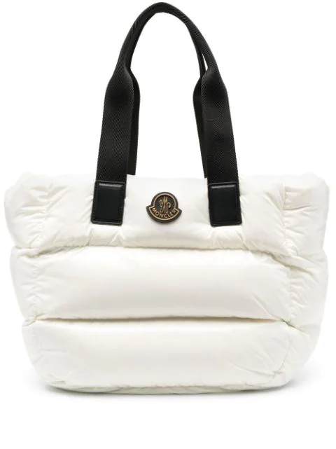 White padded bag with black handles