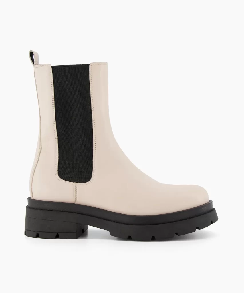 Women’s white ankle boots with black sole