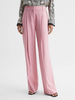 Women’s pink trousers for work outfits.
