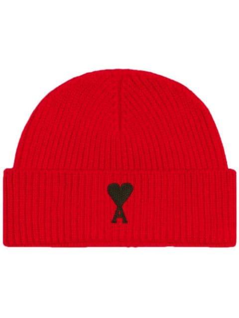 Women’s red beanie hat with black heart on it.