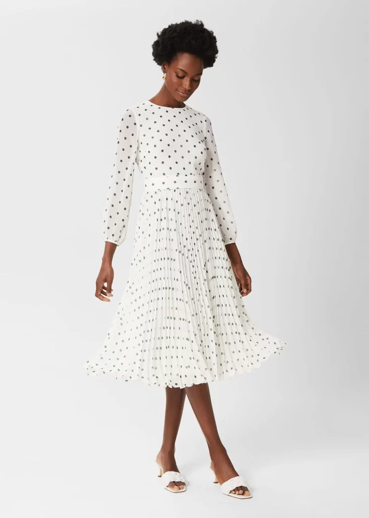 Pleated white dress with spots.