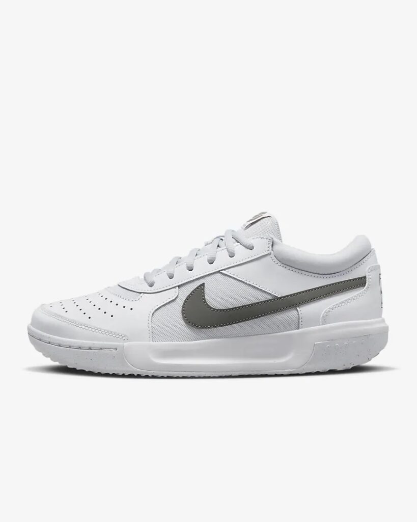 Women’s white tennis shoes with grey tick.