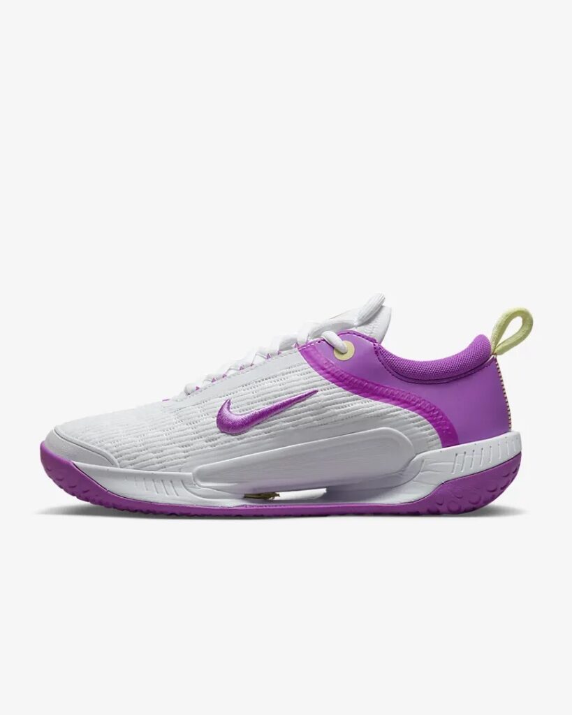 White and fuchsia Nike tennis shoes for women.