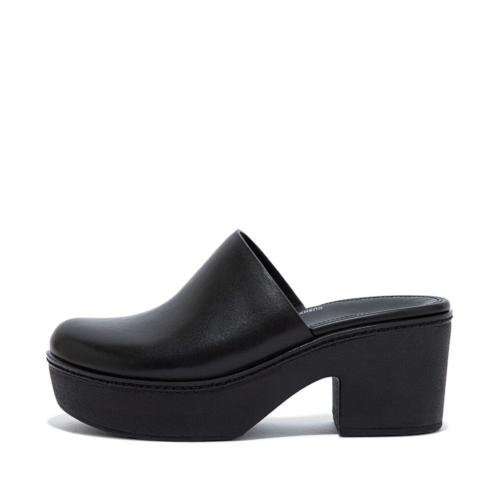 Black leather platform mules by Fit Flop.