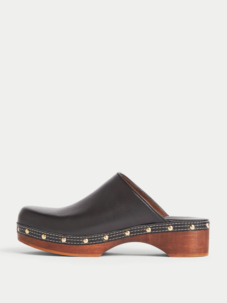 Black leather clogs with wooden heel.