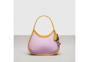 Violet and orange shoulder bag from Coachtopia.