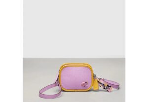 Mini crossbody bag in violet and orange.