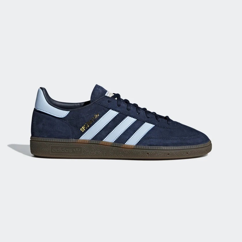 Navy Adidas Spezial shoes with light blue stripes.