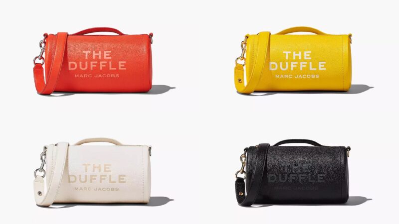 Collection of duffle bags from Marc Jacobs in orange, yellow, white and black.