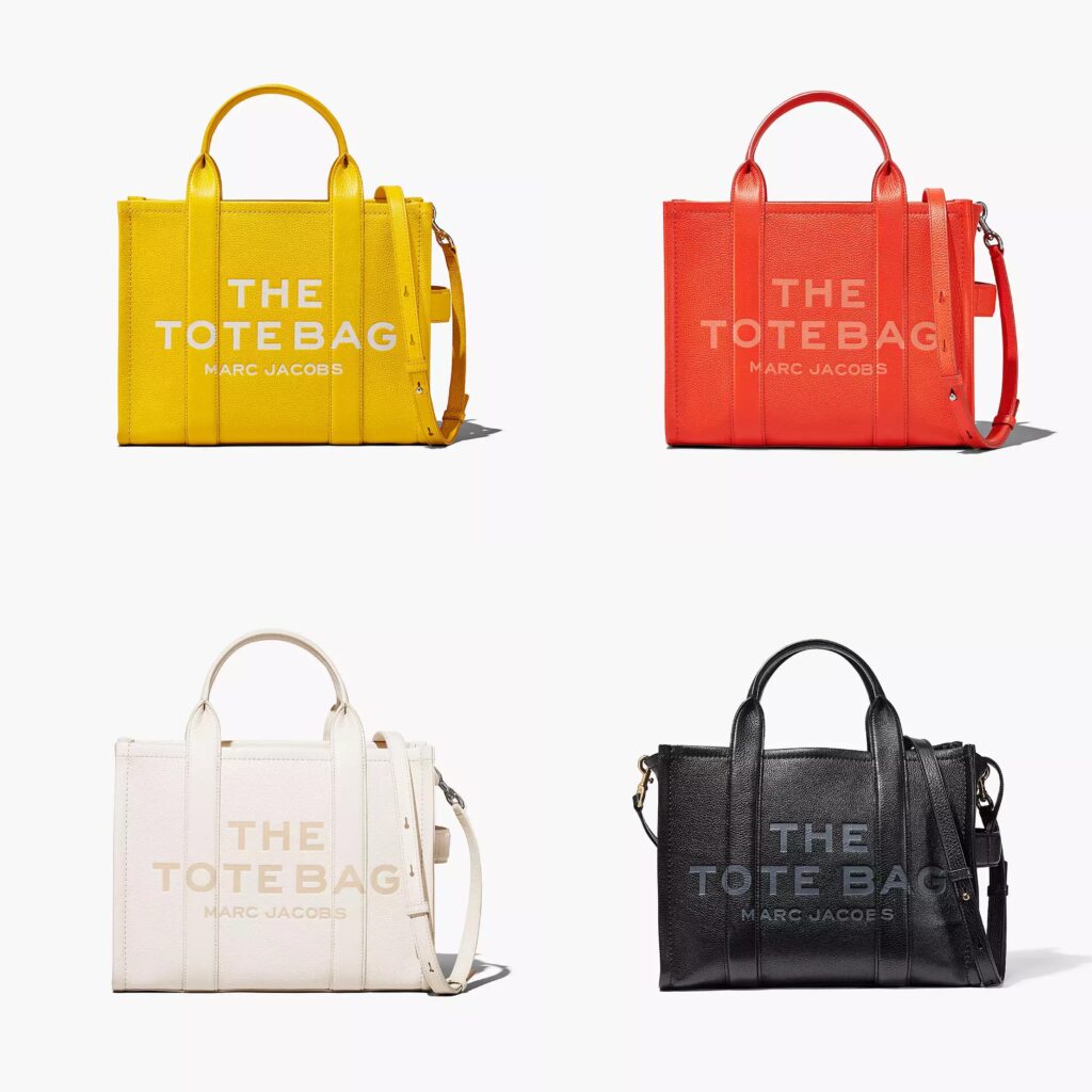 Collection of Marc Jacobs’ THE LEATHER MEDIUM TOTE BAGin electric orange, sun yellow, white and black.