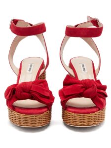 Red platform sandals with bow