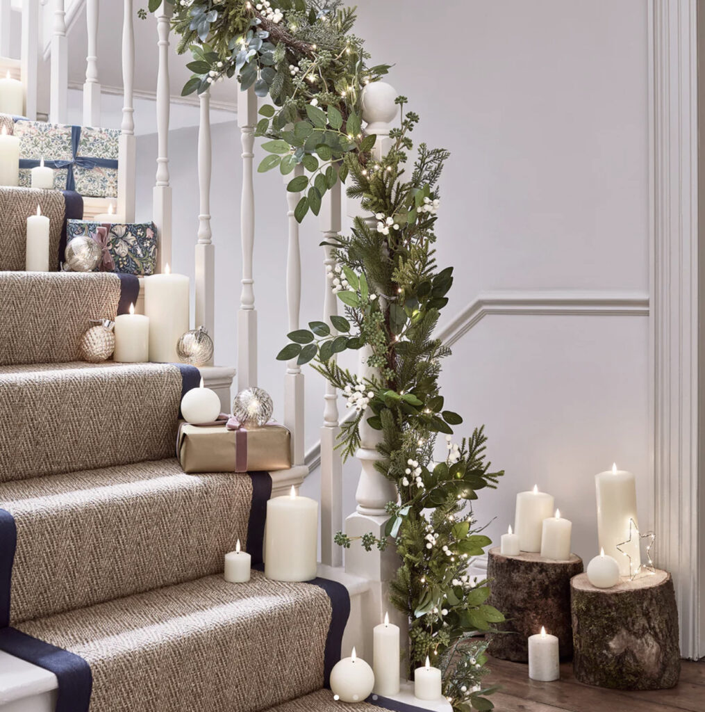 Oversized White Berry Christmas Garland on staircase