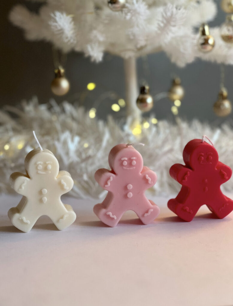 Red and pink gingerbread men candles