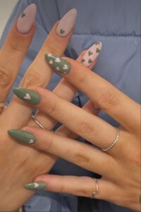 Green nails with pink hearts