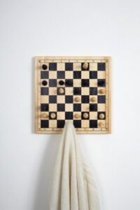 Chess board style coat hanger