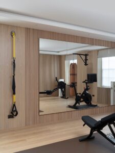 Home gym with fluted wall panels