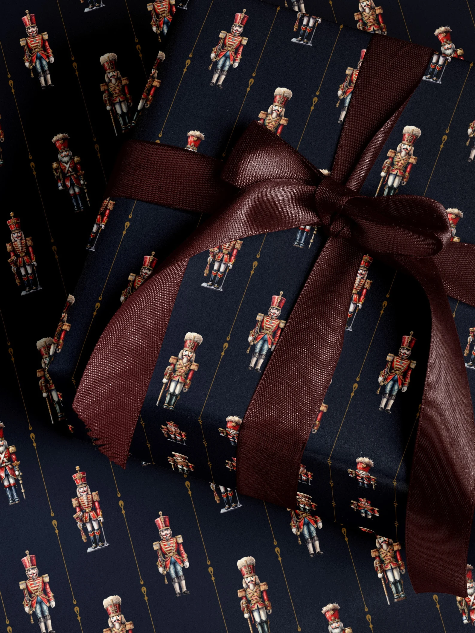 Navy wrapping paper with nutcrackers on it.